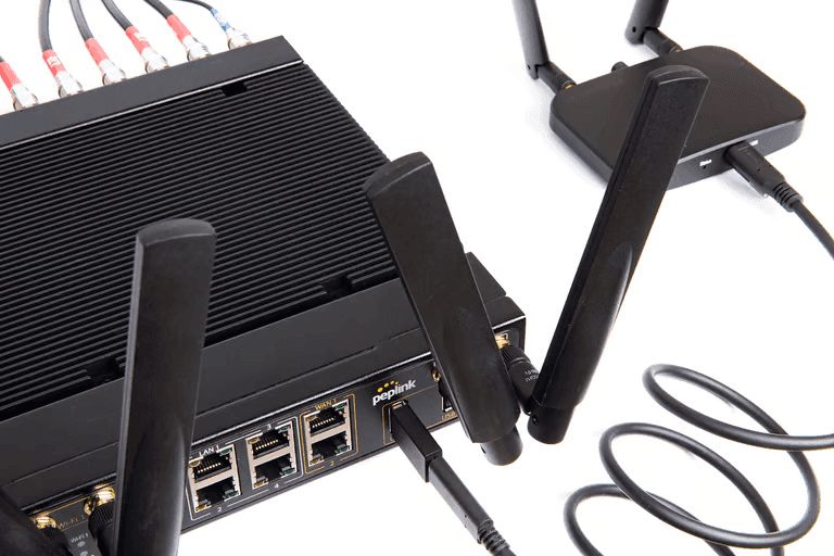 MBX Mini 5G router with external antennas attached showing full deployment setup
