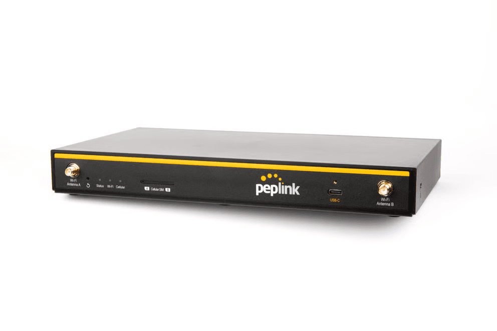 Peplink B One 5G router, front angled view showing SIM slot, USB-C port and antenna connectors