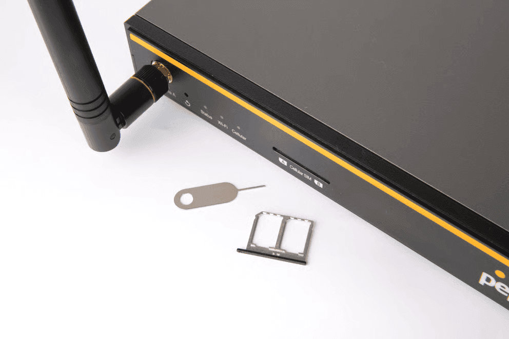 Close-up of B One 5G dual SIM tray and ejector pin beside the SIM slot