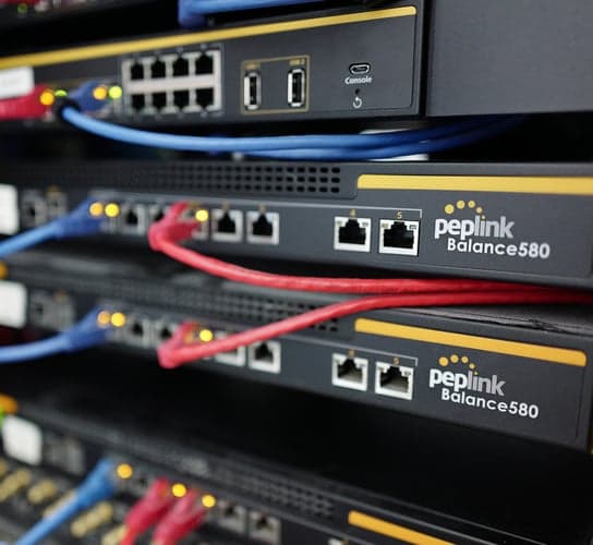 Peplink Balance 580 router, angled close-up highlighting enterprise-grade build