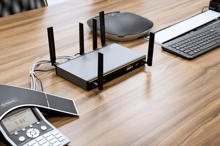 Balance 20X with antennas on a conference room table