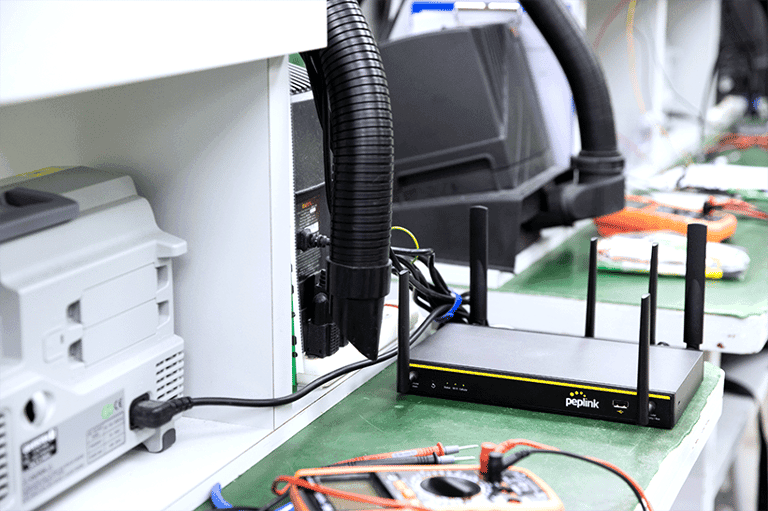 Balance 20X router on an electronics test bench