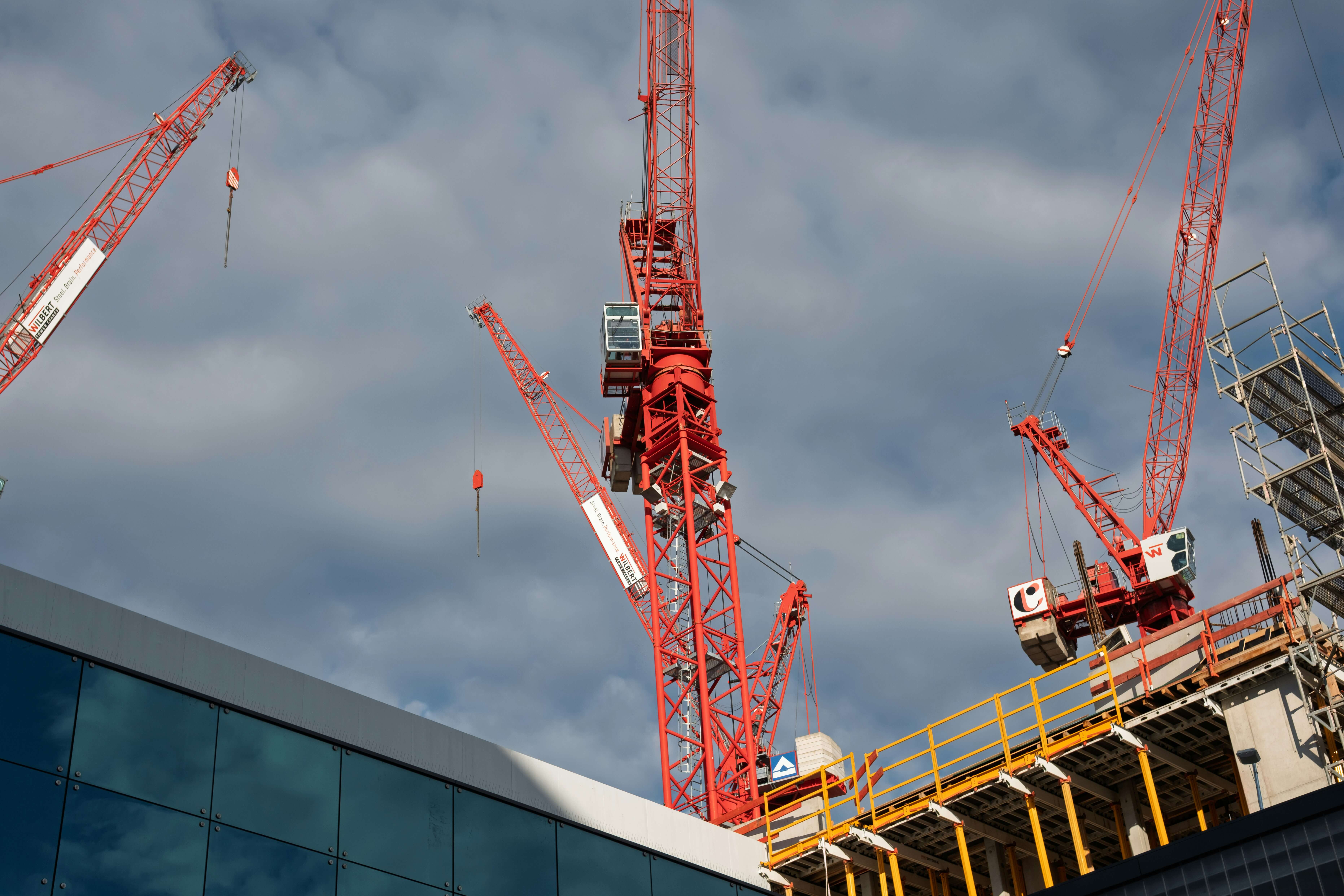 Heavy civil construction highway and bridge project scene showing rugged Paygasus Connect SD-WAN and Starlink satellite for remote infrastructure connectivity